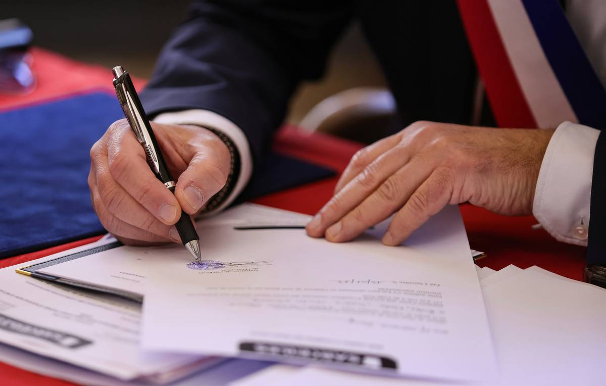 Step-by-Step Claim Submission: driver holding rental agreement and insurance documents at airport counter